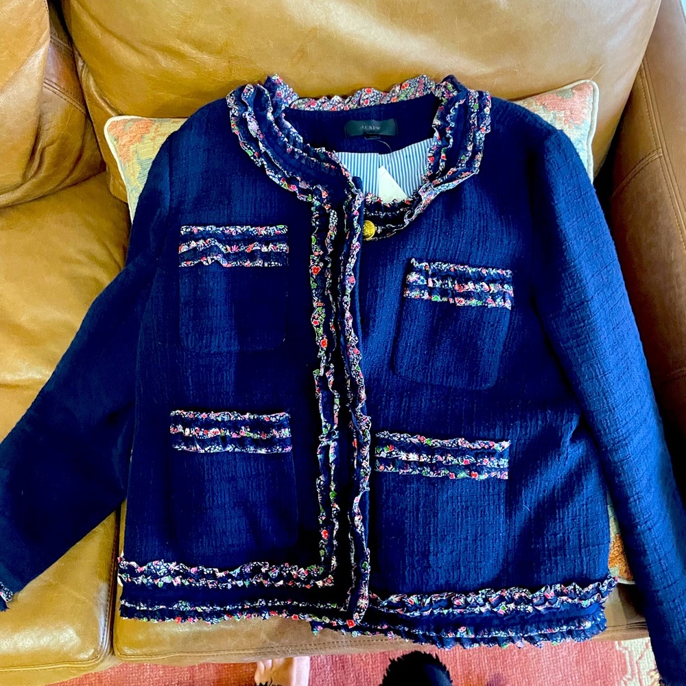 Navy blue jacket with floral pipping. The jacket is really cute